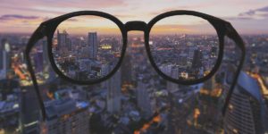 city through eye glasses