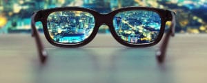 eye glasses looking at city at night